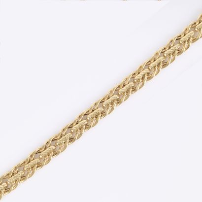 Bracelet en or maille fantaisie. Long. 19...