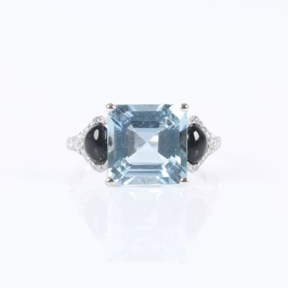 White gold ring set with a princess-cut aquamarine...