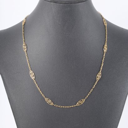 Gold necklace with oblong links and filigree...