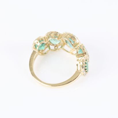 Gold ring set with a cascading row of 5 oval-cut...