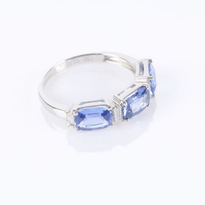 White gold half-eternity ring, set with 3...