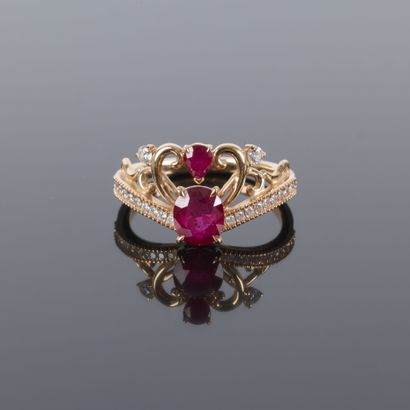 Rose gold ring featuring a tiara design set...