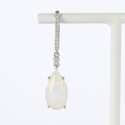 Pair of platinum earrings, each set with...