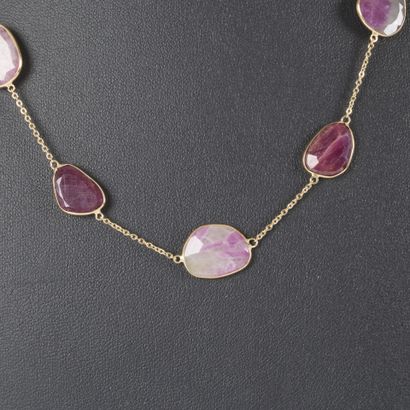 Gold necklace adorned with ruby roots set...