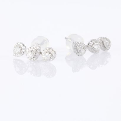 Pair of white gold earrings, each set with...