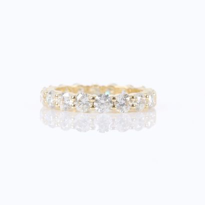 American-style gold wedding band set with...
