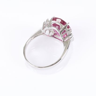 White gold ring set with a treated oval-cut...