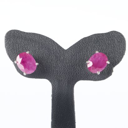 Pair of white gold earrings, each set with...