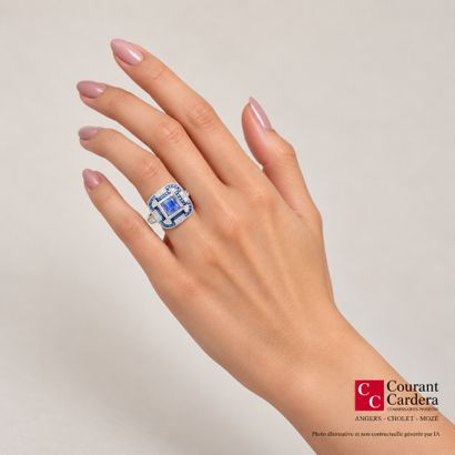 Platinum ring set with a cabochon sapphire...