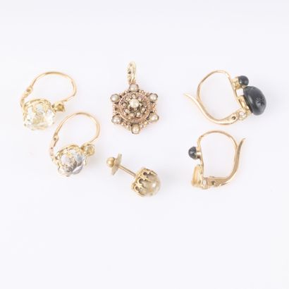 Gold jewelry set set with small stones and...