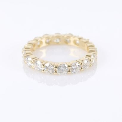 American-style gold wedding band set with...