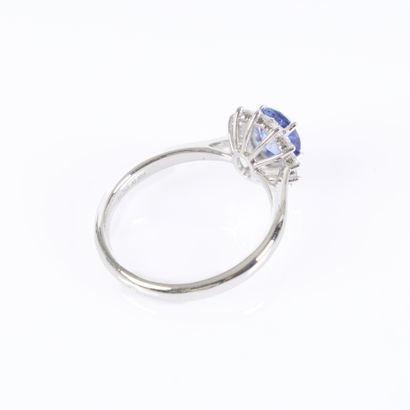 Platinum daisy ring set with an oval-cut...