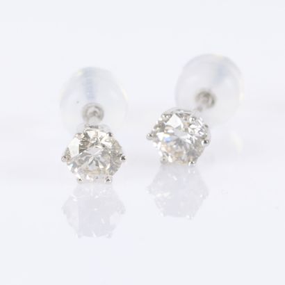 Pair of white gold earrings, each set with...