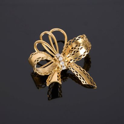 Gold and platinum bow brooch, set with 5...