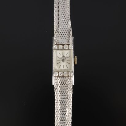 Women's white gold wristwatch; the bezel...