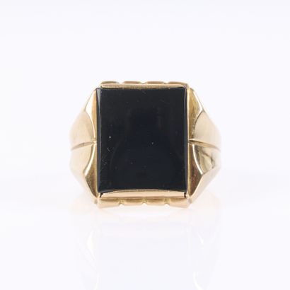 Gold signet ring set with an onyx inlay....