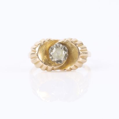 Gold ring with a crisscrossed fluted design,...