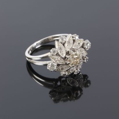 A striking daisy-shaped ring in white gold...