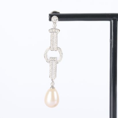 Pair of platinum earrings, each featuring...