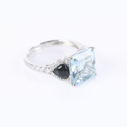 White gold ring set with a princess-cut aquamarine...