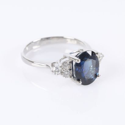 White gold ring set with an unheated oval-cut...