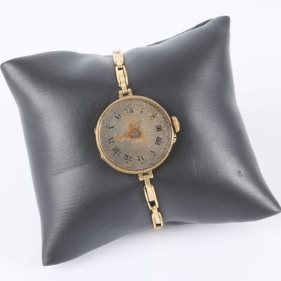 Women's gold wristwatch with a mechanical...