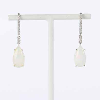 Pair of platinum earrings, each set with...