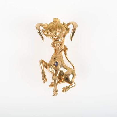 Gold brooch decorated with a bull; the necklace...