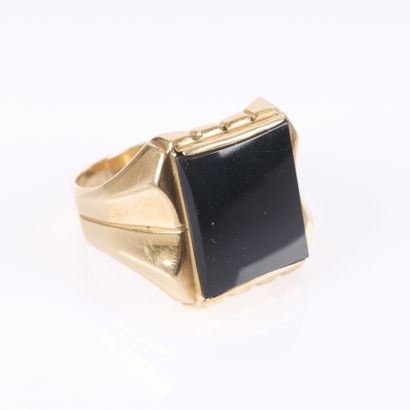 Gold signet ring set with an onyx inlay....