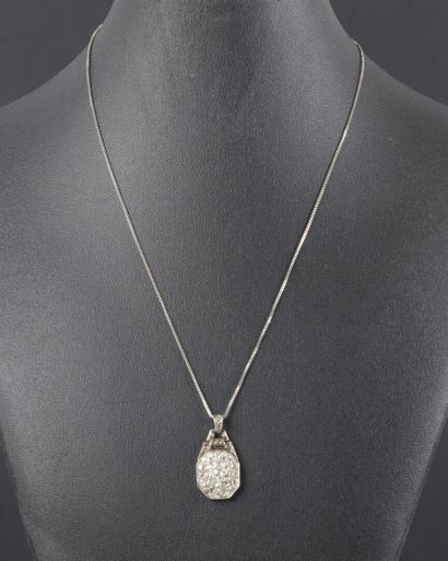 Art Deco pendant featuring a pavé setting...
