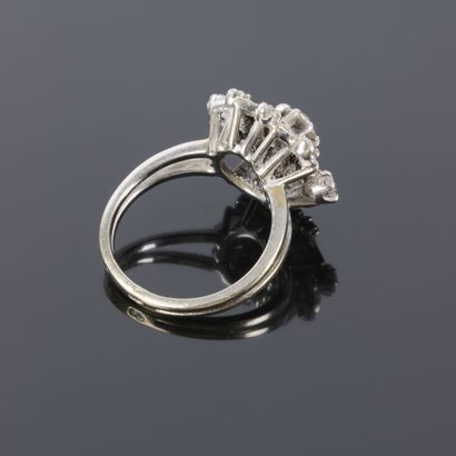 A striking daisy-shaped ring in white gold...