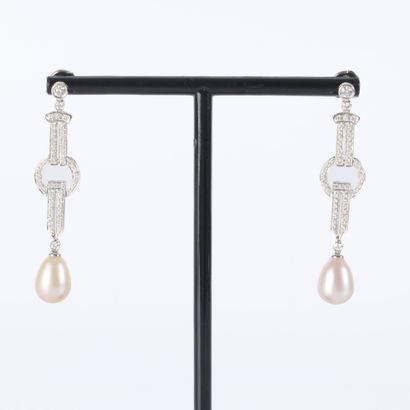 Pair of platinum earrings, each featuring...