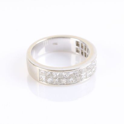 White gold ring set with princess-cut diamonds...