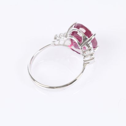 White gold ring set with a treated oval-cut...