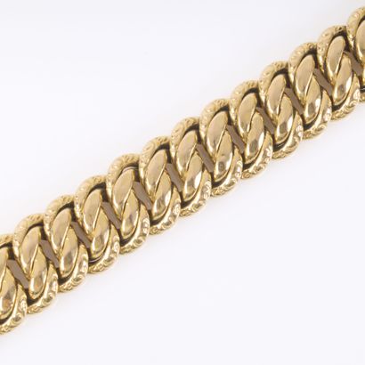 Bracelet en or maille américaine. 19 cm....