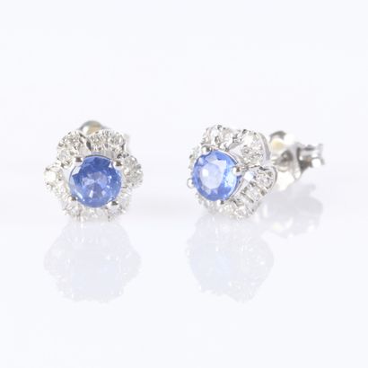 Pair of white gold earrings, each set with...
