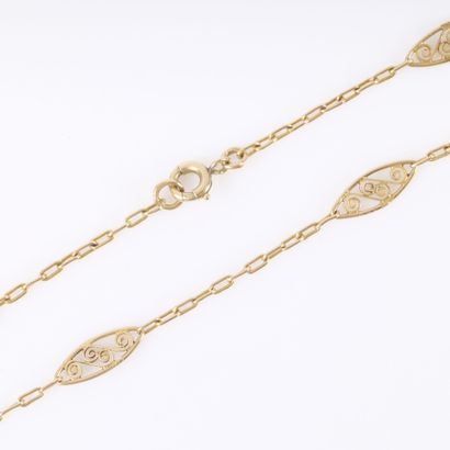 Gold necklace with oblong links and filigree...