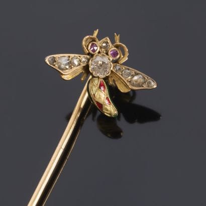 Gold brooch featuring an insect motif; the...
