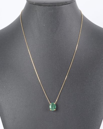 Gold necklace featuring an oval-cut emerald...