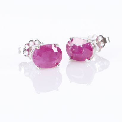 Pair of white gold earrings, each set with...