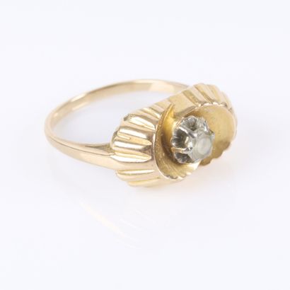 Gold ring with a crisscrossed fluted design,...