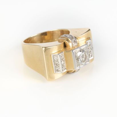 A striking tank-style ring in gold and platinum,...