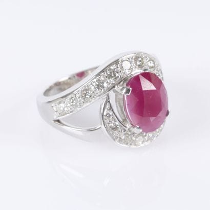 White gold ring set with an unheated oval-cut...