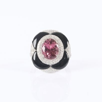 Stunning white gold ring set with an oval-cut...