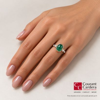 White gold ring set with an oval cabochon...