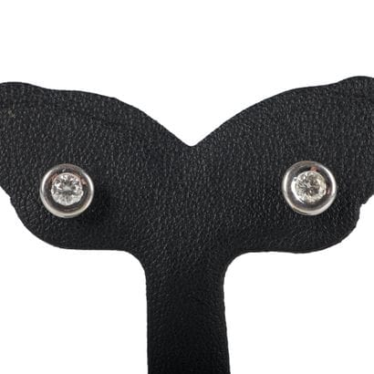 Pair of white gold stud earrings each set...