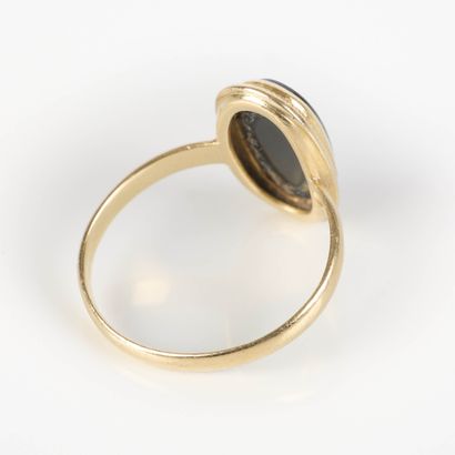 Gold ring set with an oval-shaped jet stone....