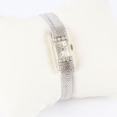 Women's white gold wristwatch; the bezel...