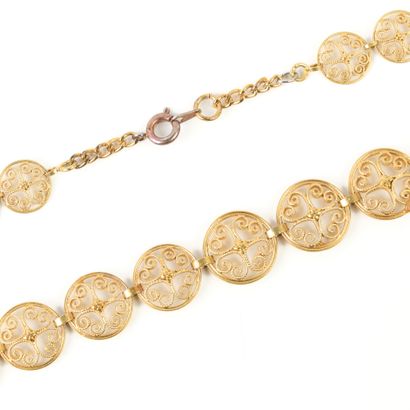 Gold necklace, decorated with falling filigree...