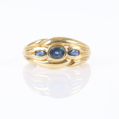 . Gold ring set with three small sapphires....
